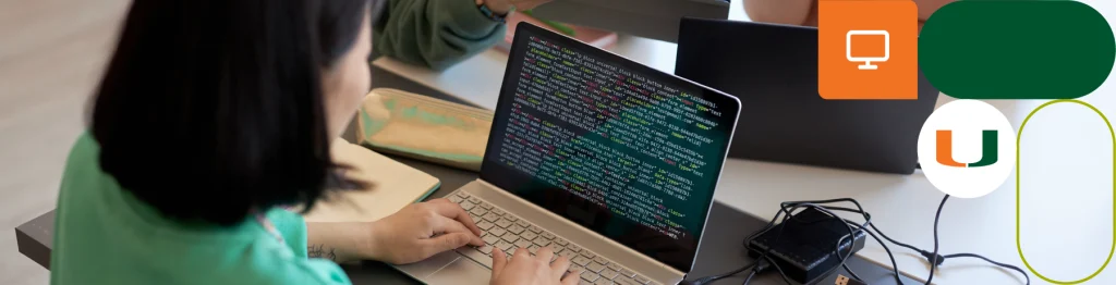 “Person coding on a laptop with books and a smartphone nearby.”

